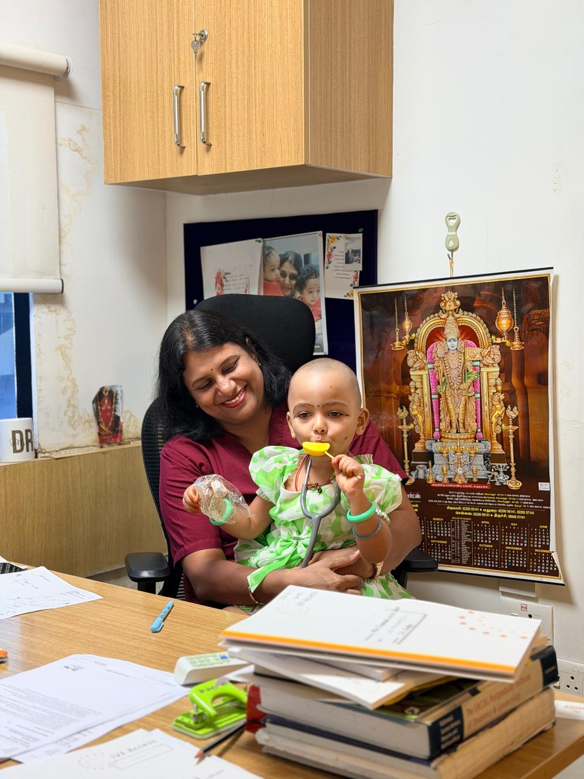 Dr. Sandhya sharing a warm moment with a child at the clinic