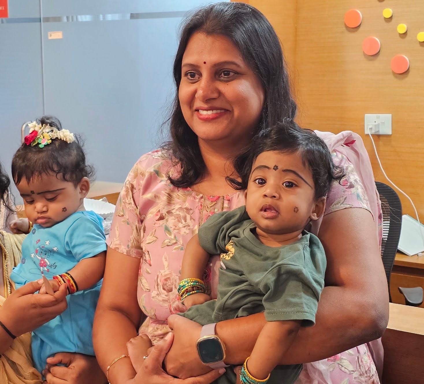 Dr. Sandhya with children during a family clinic visit